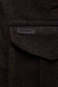Barbour Tweed Hereford Tweed Wool in Rustic Brown Herringbone MWO0290BR71 logo